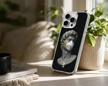 Phone case featuring a masked statue on a black background. — Lifestyle