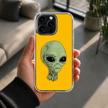 Alien cartoon character with green skin on yellow backdrop phone case — Lifestyle