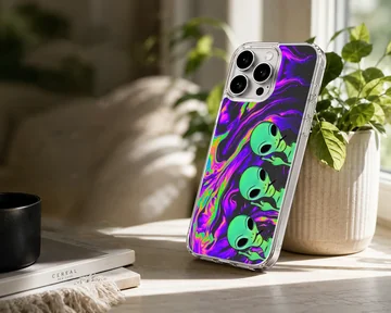 Aliens cartoon design on a phone case with vibrant colors — Lifestyle