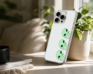 Three playful cartoon aliens on a phone case — Lifestyle