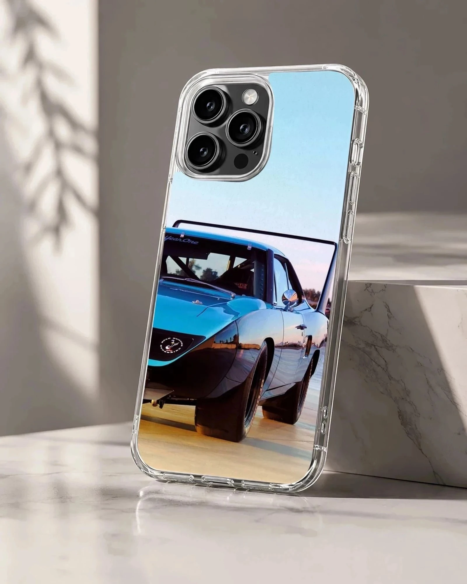 American muscle car speeding along a road, phone case design.