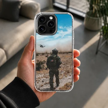 Army design showcasing heroic scene with soldier and helicopter on phone case. — Lifestyle