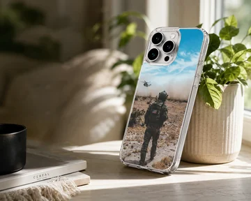 Army design showcasing heroic scene with soldier and helicopter on phone case. — Lifestyle