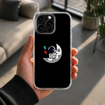 Astronaut floating on a moon with a black background phone case — Lifestyle