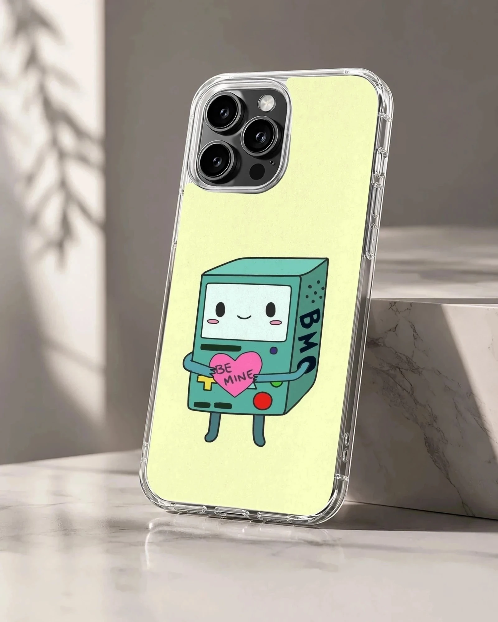 BMO holding a heart with 'Be Mine' cartoon art on phone case