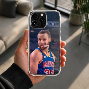 Dynamic basketball player in action, wearing a blue and yellow jersey on a phone case — Lifestyle