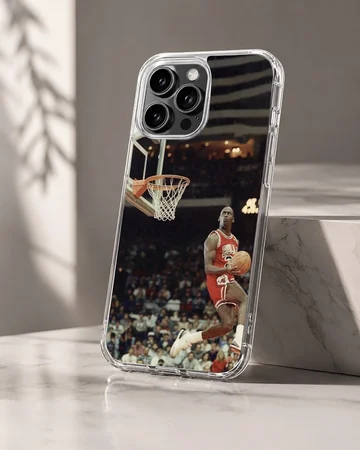Dynamic basketball player dunking in a stadium phone case — Hero