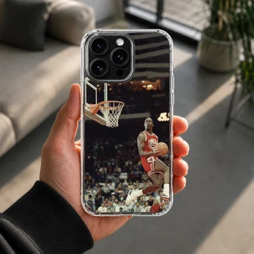 Dynamic basketball player dunking in a stadium phone case — Lifestyle