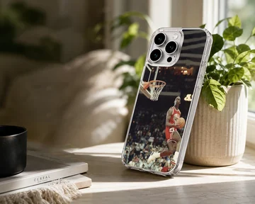 Dynamic basketball player dunking in a stadium phone case — Lifestyle
