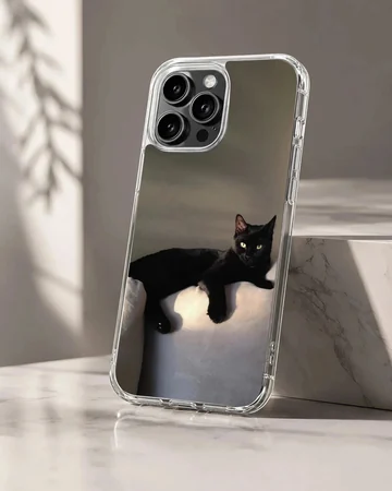 Black cat lounging in serene setting on phone case