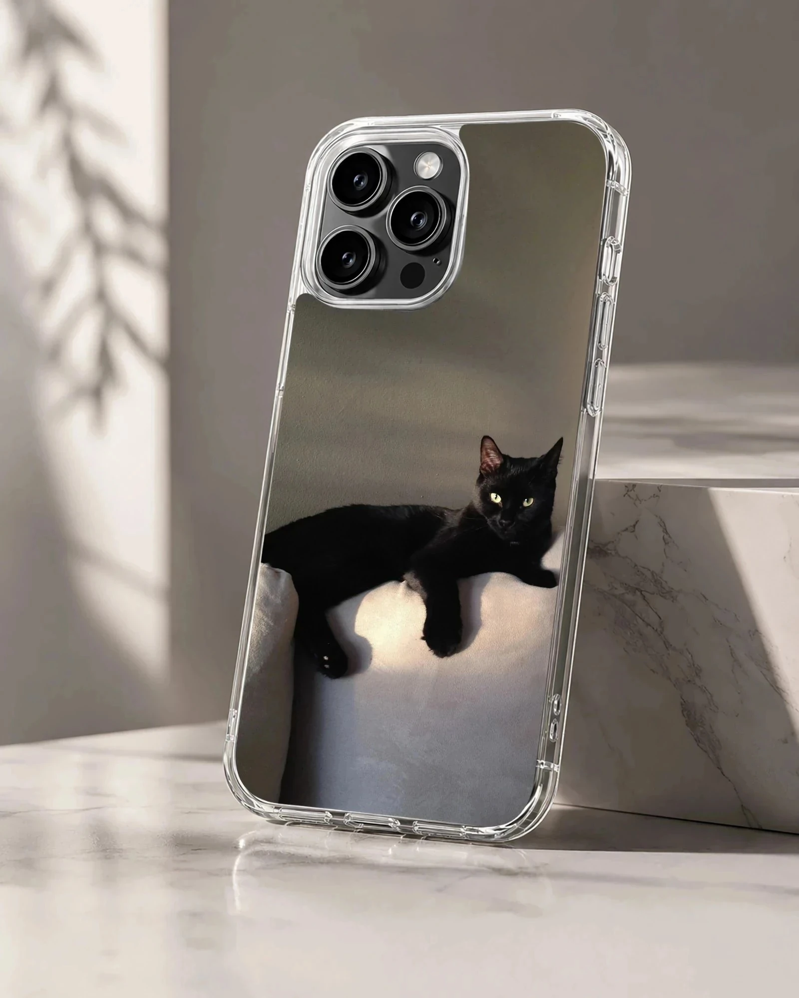 Black cat lounging in serene setting on phone case