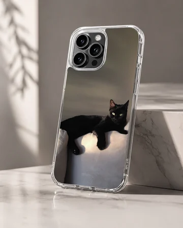 Black cat lounging in serene setting on phone case — Hero