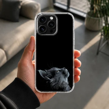 Black cat looking up on a phone case — Lifestyle