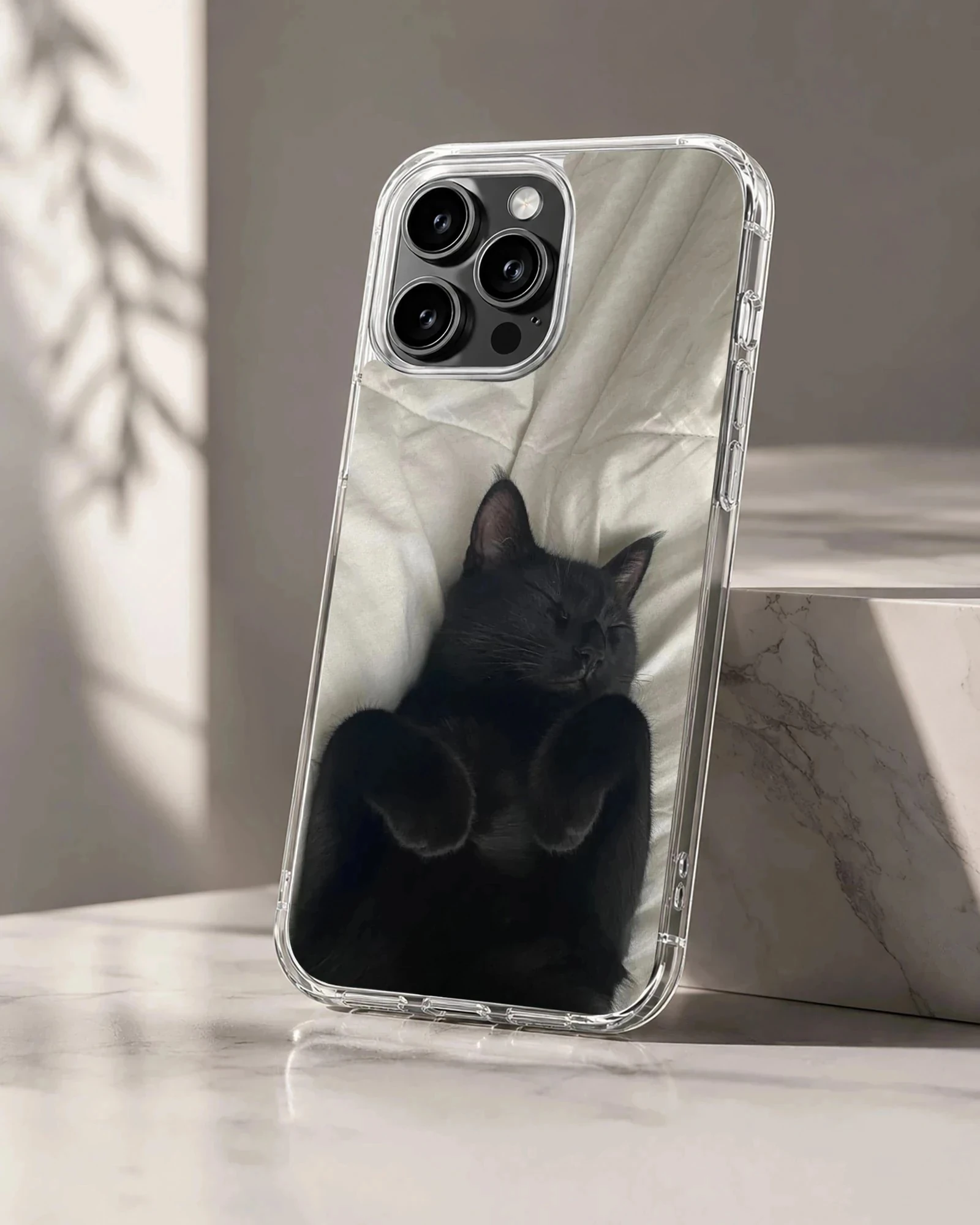 Black cat lounging on soft fabric design phone case