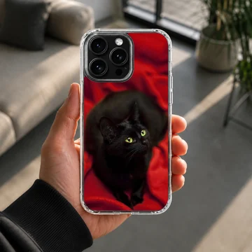Black cat with green eyes on red background phone case — Lifestyle