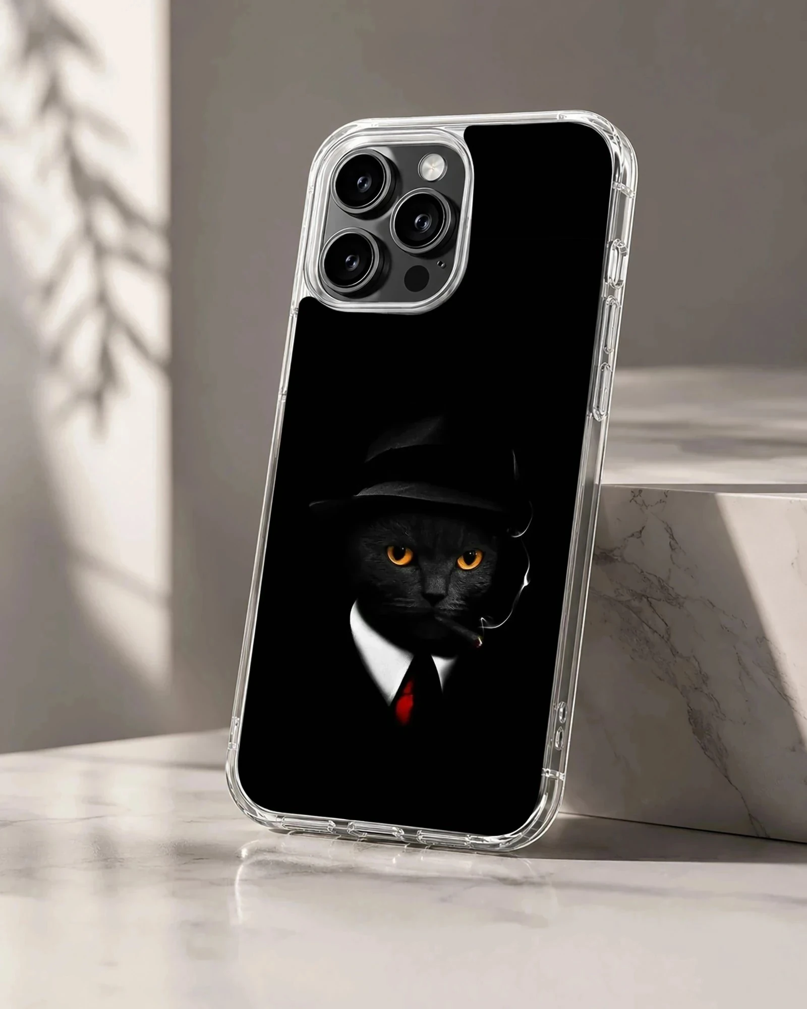 Phone case featuring black cat with hat and orange eyes