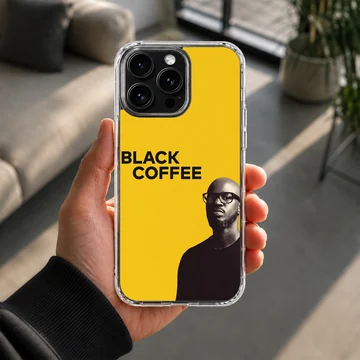Bold Black Coffee artwork on a minimalist yellow phone case — Lifestyle