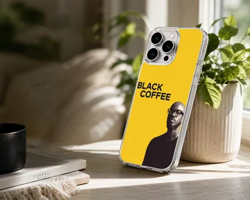 Bold Black Coffee artwork on a minimalist yellow phone case — Lifestyle