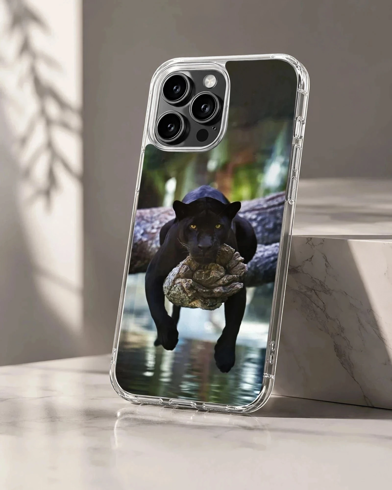 Dynamic black panther resting on tree over water, nature phone case