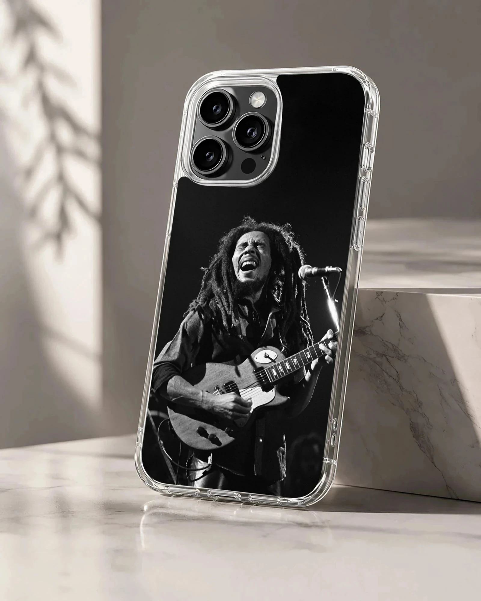 Iconic photograph of Bob Marley playing guitar on phone case