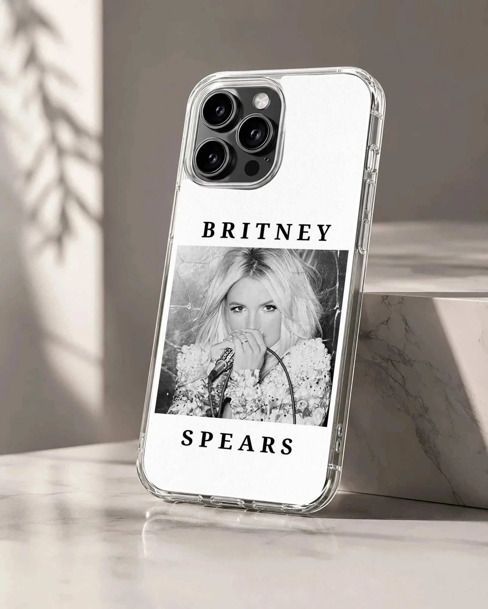 Phone case featuring a monochrome photograph of Britney Spears with bold typography.