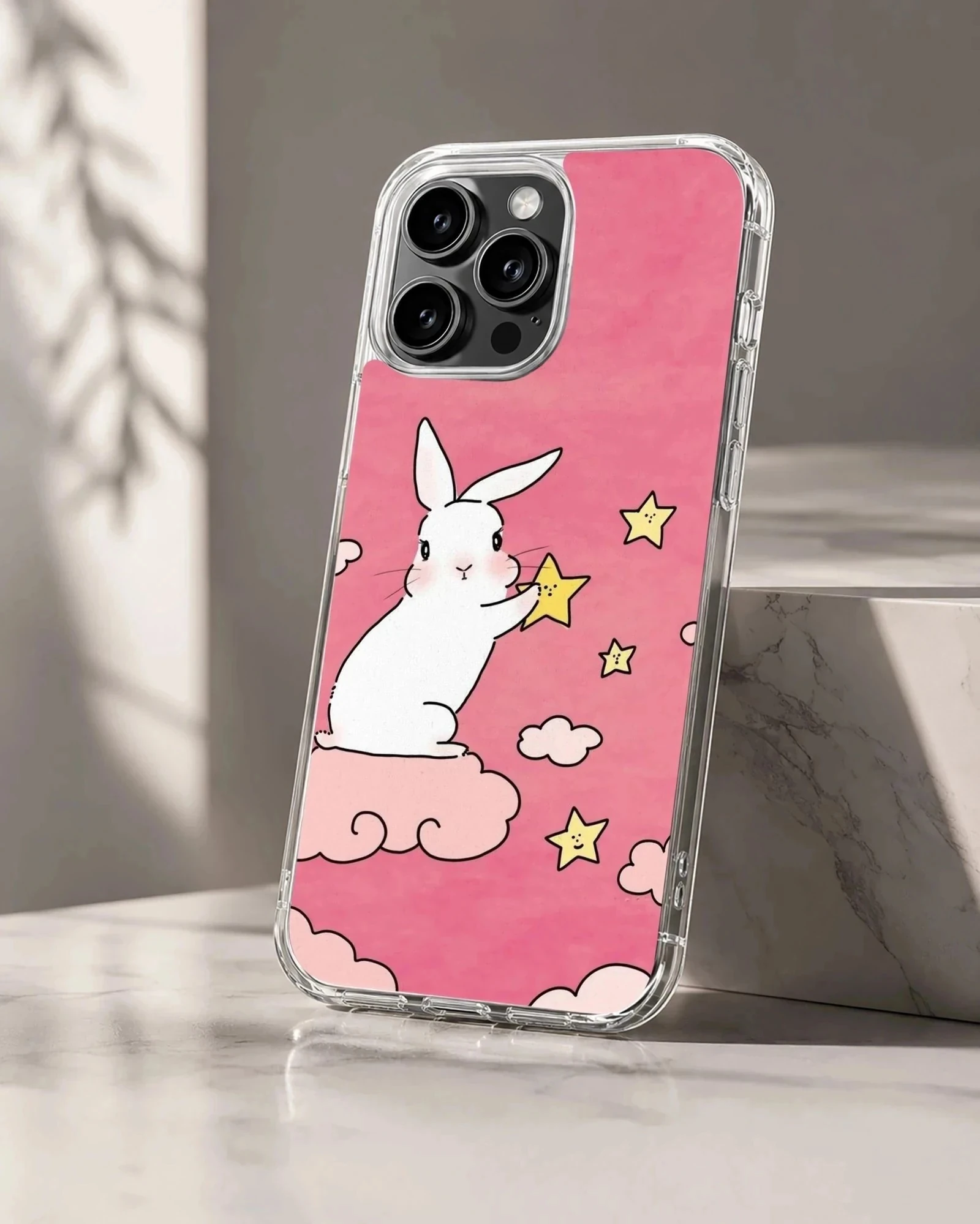 Bunny rabbit with stars on pink background phone case
