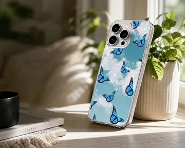 Blue butterflies in a dreamlike sky on phone case — Lifestyle