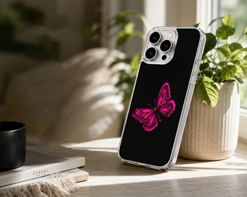 Phone case with a vibrant pink butterfly on a black background — Lifestyle