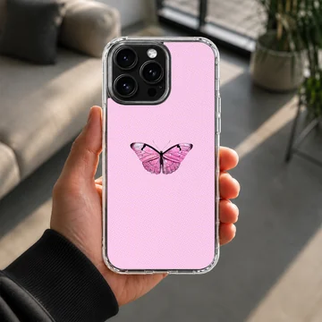 Pink butterfly on a phone case with a light pink background — Lifestyle