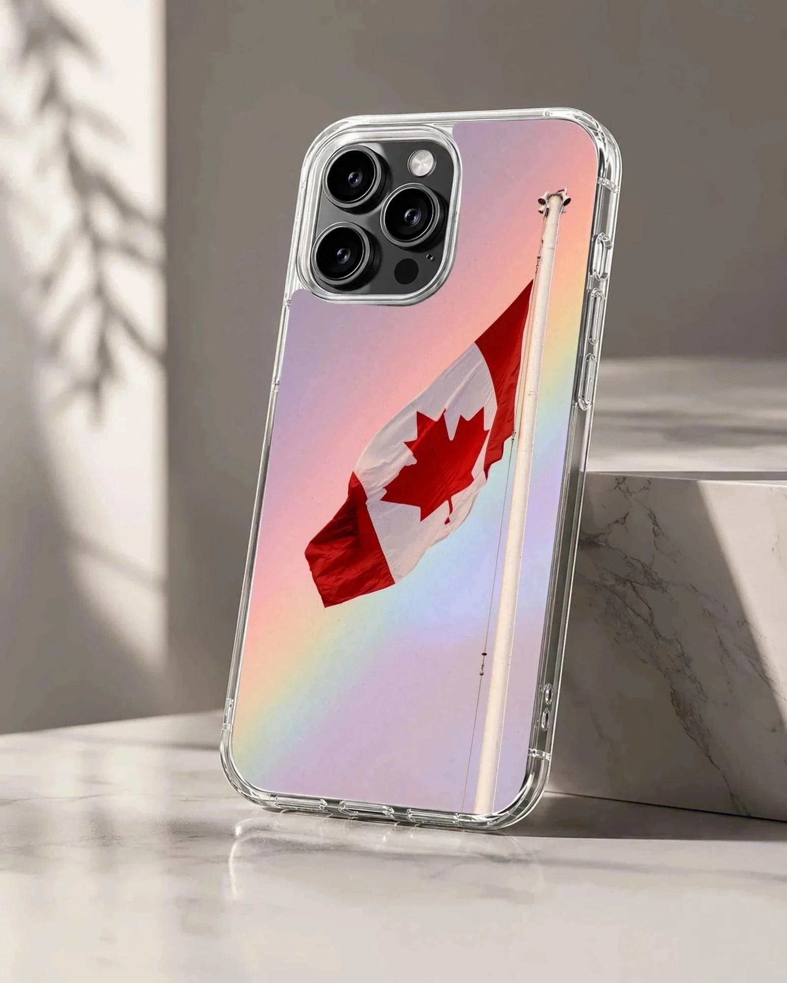 A Canadian flag waving against a soft pastel gradient sky on a phone case