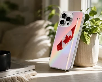 A Canadian flag waving against a soft pastel gradient sky on a phone case — Lifestyle