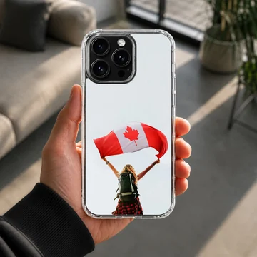 A hiker with a backpack holds up a waving Canadian flag against a pale sky on a phone case — Lifestyle