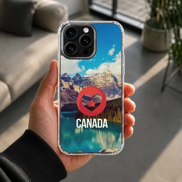 Scenic mountain and lake view with a red heart and maple leaf symbol above the word CANADA on a phone case — Lifestyle