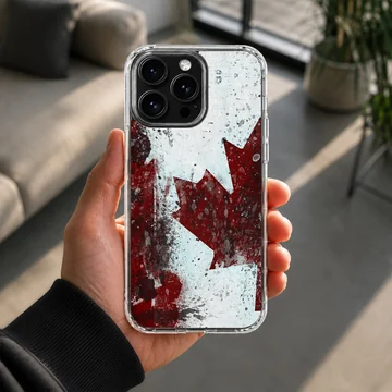 Distressed red and white Canadian flag maple leaf artwork on a phone case — Lifestyle