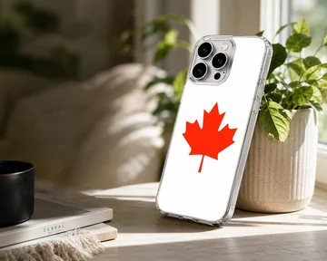 A minimalist white phone case featuring a bold red Canadian maple leaf illustration phone case — Lifestyle