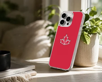 Vibrant red phone case featuring a stylized white and black bordered maple leaf symbol inspired by the Canadian flag — Lifestyle