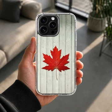 Vibrant red maple leaf resting on weathered white wooden planks on a phone case — Lifestyle