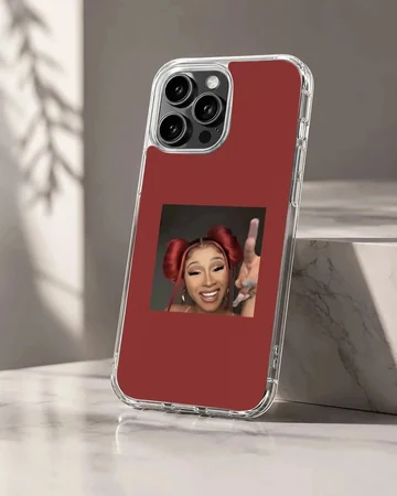 Portrait of Cardi B with red hair buns set against a rich red background on a phone case