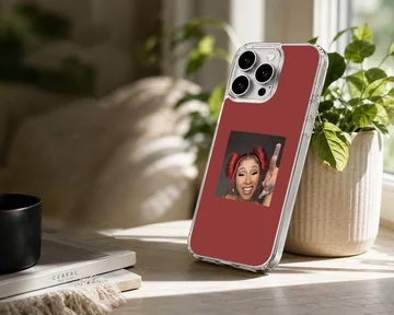 Portrait of Cardi B with red hair buns set against a rich red background on a phone case — Lifestyle