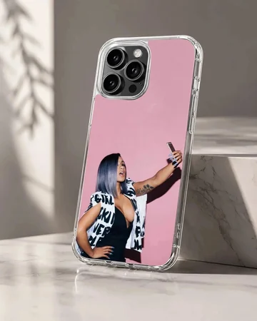 Cardi B taking a selfie in front of a pink wall printed on a phone case