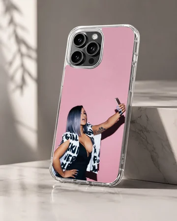 Cardi B taking a selfie in front of a pink wall printed on a phone case — Hero