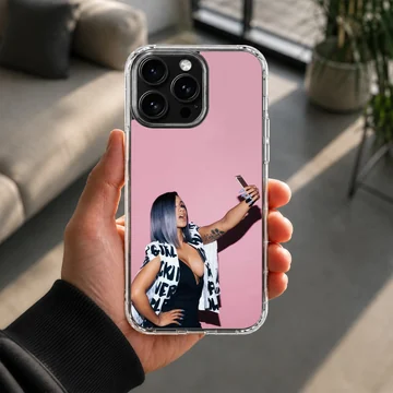 Cardi B taking a selfie in front of a pink wall printed on a phone case — Lifestyle