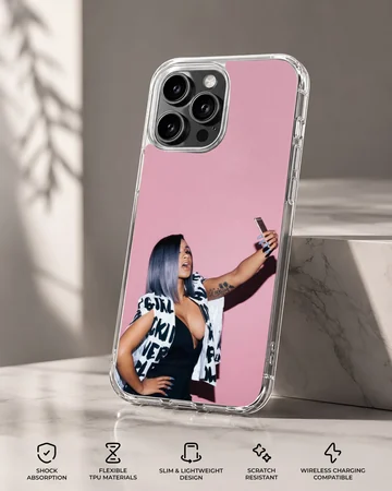 Cardi B taking a selfie in front of a pink wall printed on a phone case — Specs