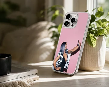 Cardi B taking a selfie in front of a pink wall printed on a phone case — Lifestyle