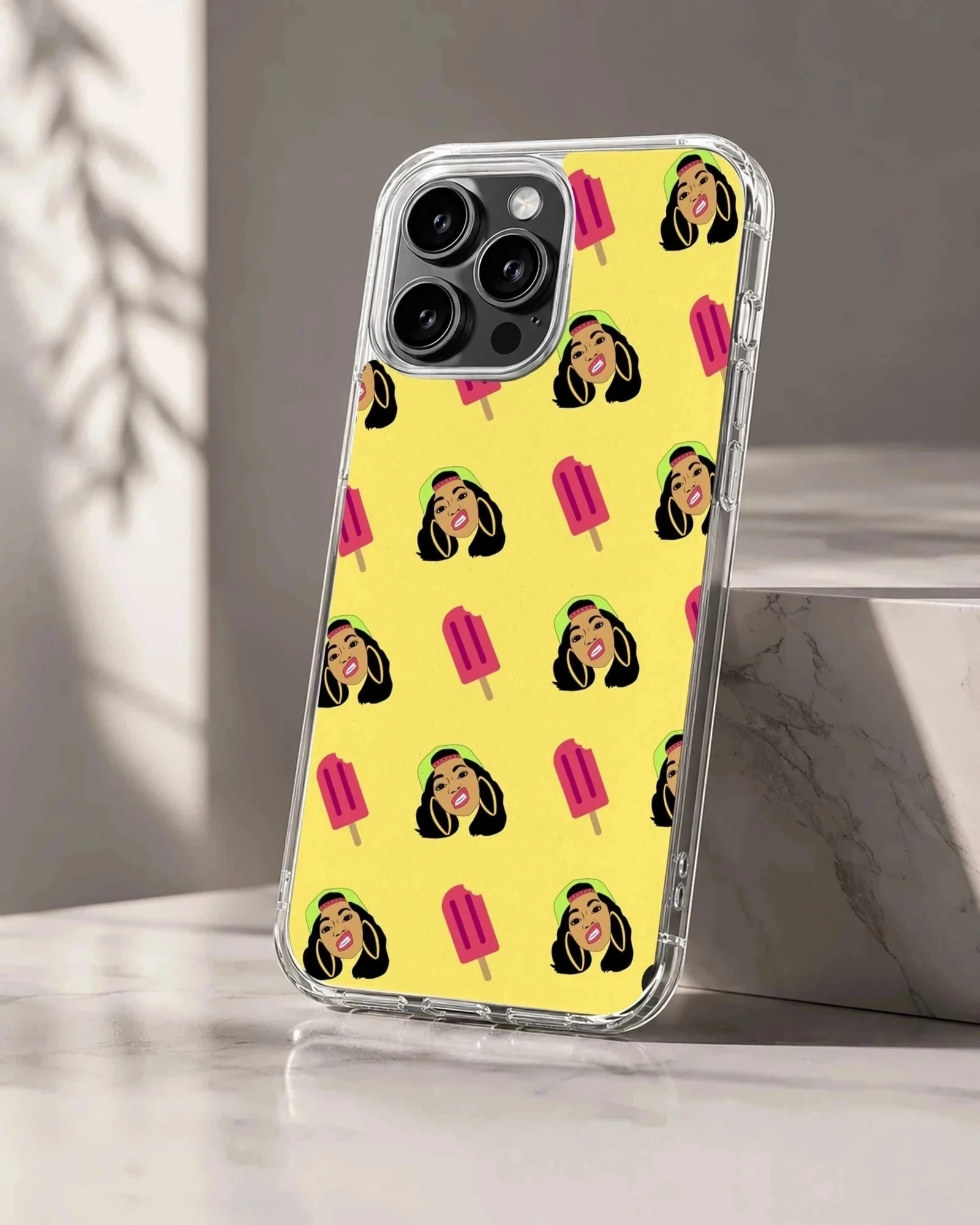 A repeat pattern phone case featuring stylized illustrations of a female rapper and pink popsicles on a yellow background
