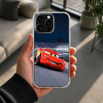 A vibrant red race car speeding around a track under stadium lights phone case — Lifestyle