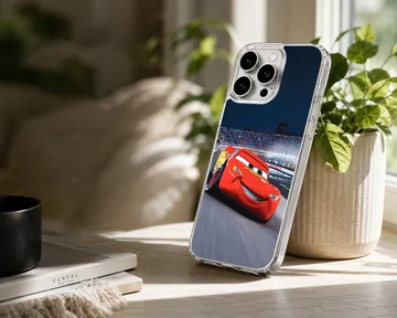 A vibrant red race car speeding around a track under stadium lights phone case — Lifestyle