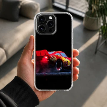 Red racing car captured mid-burnout against a black background on a phone case — Lifestyle