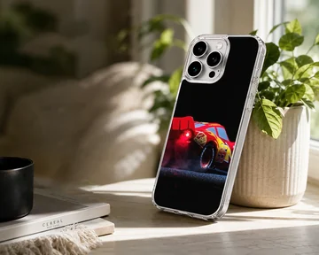 Red racing car captured mid-burnout against a black background on a phone case — Lifestyle