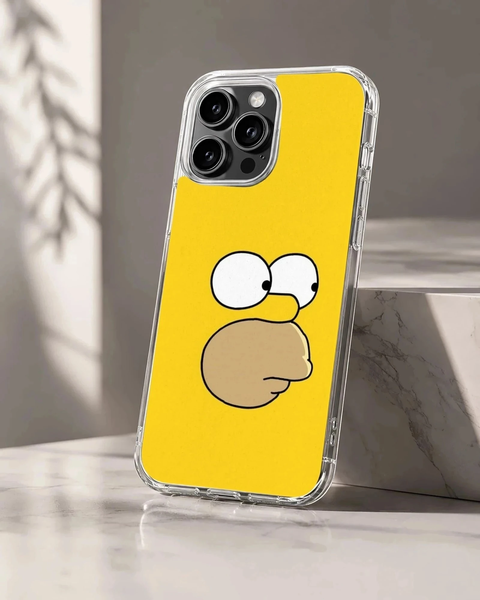 Close-up of a cartoon yellow character face with wide eyes and a prominent snout on a phone case